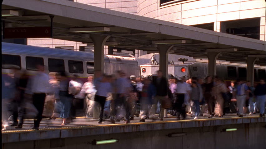 Passengers leaving train platform
