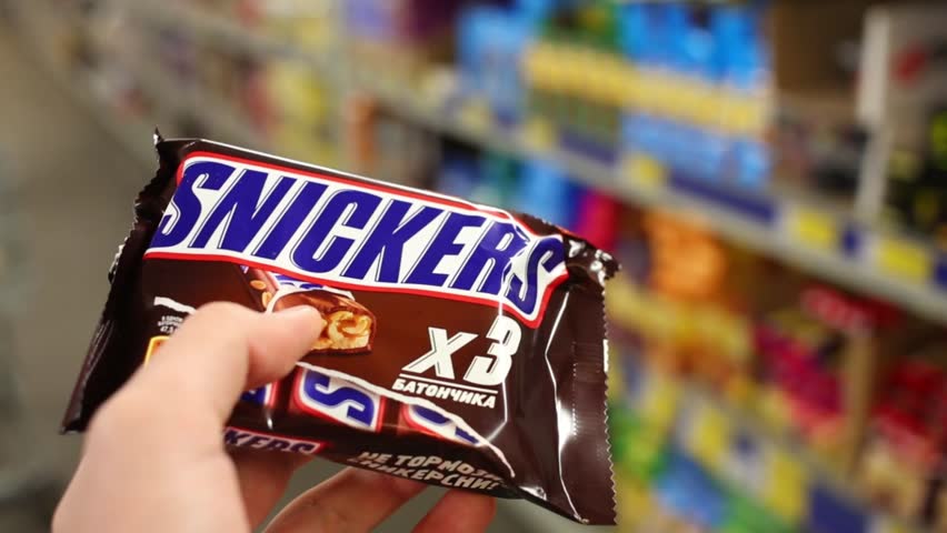 I need a new of snickers. Шоколад сникерс футаж. snickers in the supermarket.