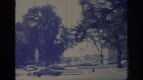 SACRAMENTO, CALIFORNIA 1966: Car driving down street