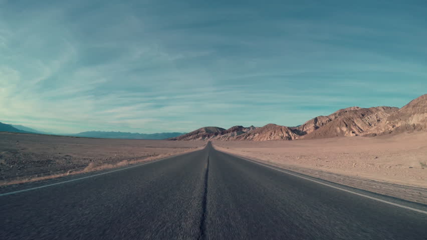 Driving Down Center Of Desert Road, Then Car Transitions To Right Lane Royalty-Free Stock Footage #21610615