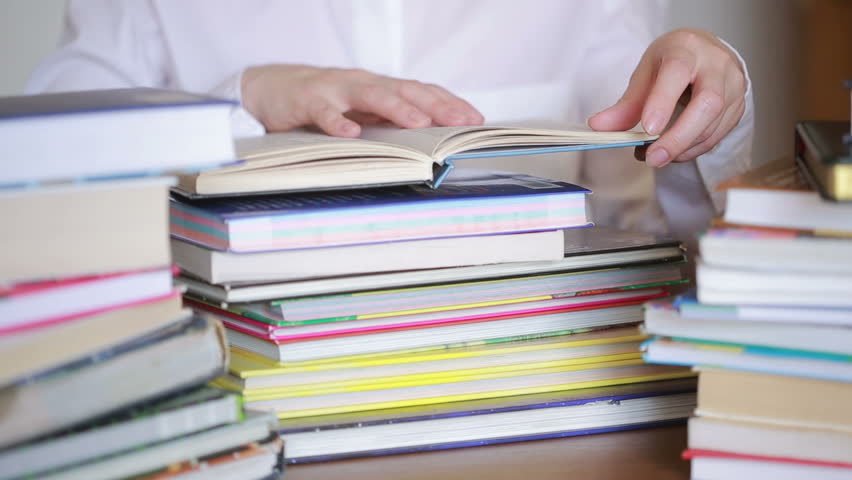 Education school concept. Closeup female girl in college library with books
