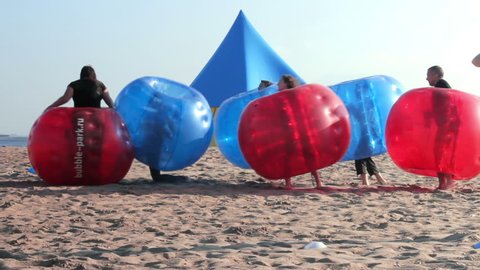 Zorbing on the Sand. Active Games Inside Zorb Bubble Balls. Russia, june 2016
