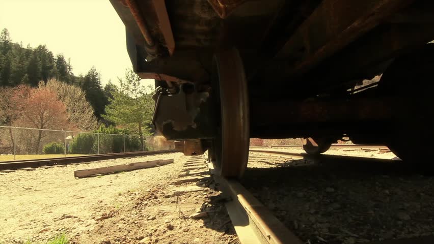 An old train sitting on the train tracks