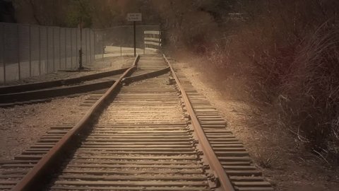 An old train sitting on the train tracks