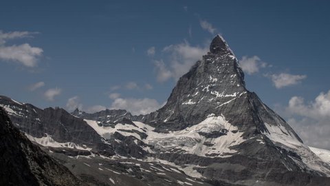 the amazing matterhorn and surrounding mountains in the Swiss Alps with fantastic cloud formations