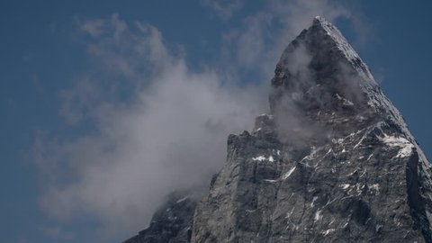 the amazing matterhorn and surrounding mountains in the Swiss Alps with fantastic cloud formations