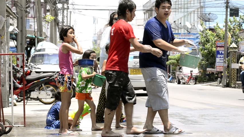BANGKOK - APRIL 13: People enjoying the annual Songkran festivities with a water