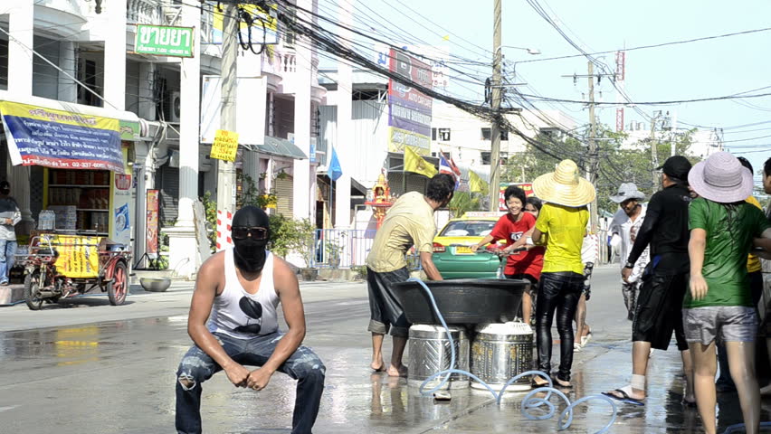 BANGKOK - APRIL 13: People enjoying the annual Songkran festivities with a water