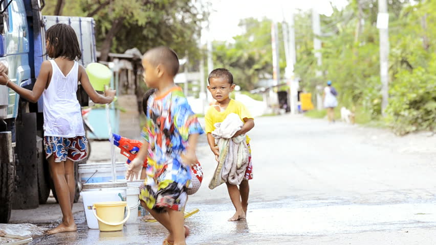 BANGKOK - APRIL 13: Children enjoying the annual Songkran festivities with a