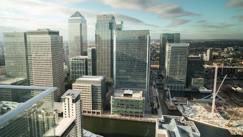 timelapse of the financial skyscrapers of london docklands, canary wharf shot from a unique high vantage point