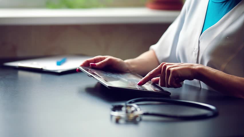 Woman doctor using tablet computer in hospital Royalty-Free Stock Footage #21635851