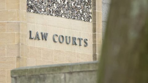 Law Courts sign on the exterior of a crown court building, UK