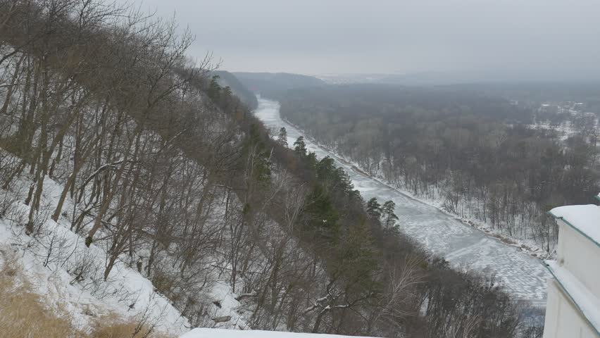 View From Observation Deck of Holy Mountains, Bare Trees on a Hill Near Cave Monastery, St. Nicholas Church, Wintry Landscape Top Down, Nature of Church Complex. River and Bridge Over It. Park of