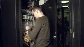 Workers a Data Center Connect Equipment - Powered by Shutterstock - Get 15% off with code: PIKWIZARD15