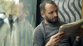 Young man reading newspaper and drinking coffee in cafe
 - Powered by Shutterstock - Get 15% off with code: PIKWIZARD15