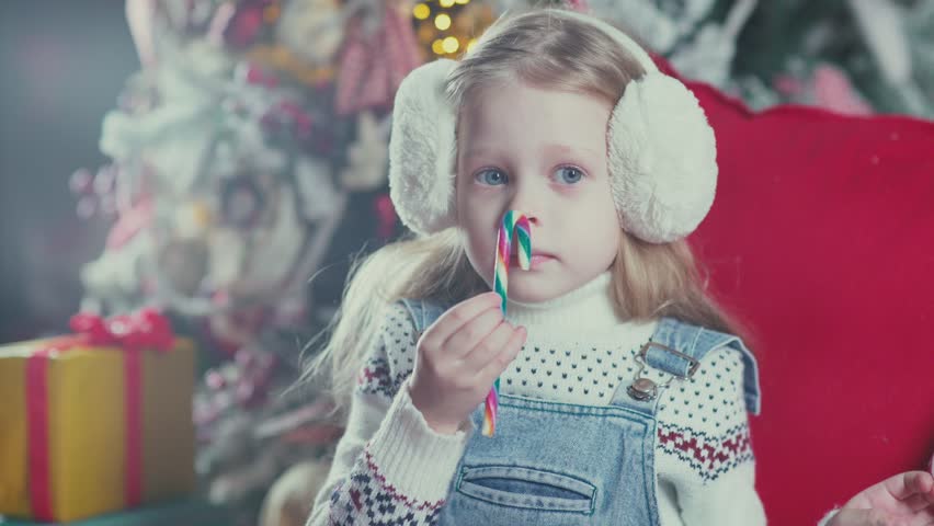 little girl in overalls