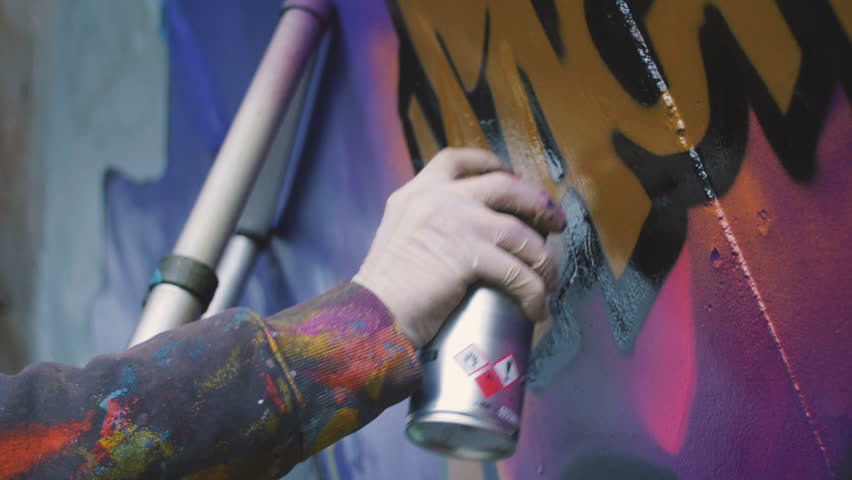 Graffiti  artist painting on the wall, exterior, close up Royalty-Free Stock Footage #21660112