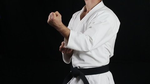 A guy with a black belt does professionally blow