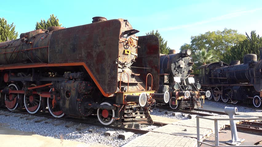 Selcuk, Turkey - 26th of October, 2016:  4K At the Selcuk locomotive museum - Panning exposition of old steam locomotives
