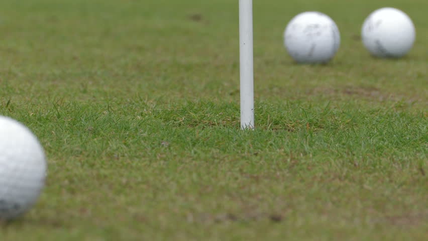 Golf - ball into cup 