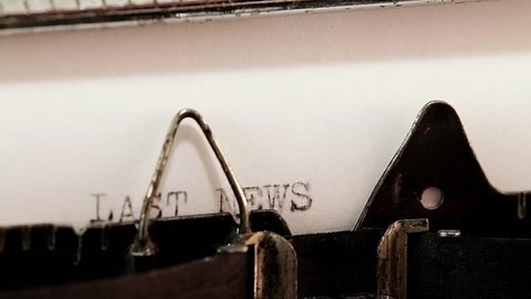 Typing with old typewriting machine words last news