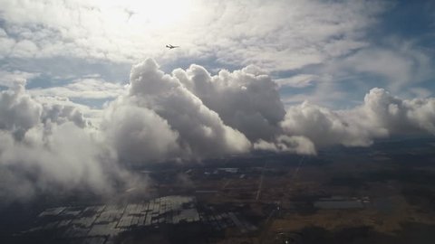 A military plane on a background of clouds
