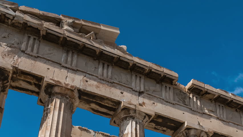 Time lapse of Parthenon at the Acropolis with passing clouds zoom out motion