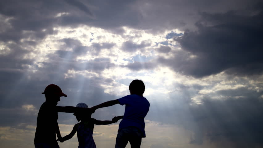 Silhouette children circle holding hands against the sky at sunset | Shutterstock HD Video #21692722