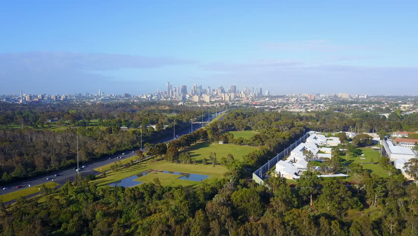 4k aerial video with view of Melbourne CBD and highway