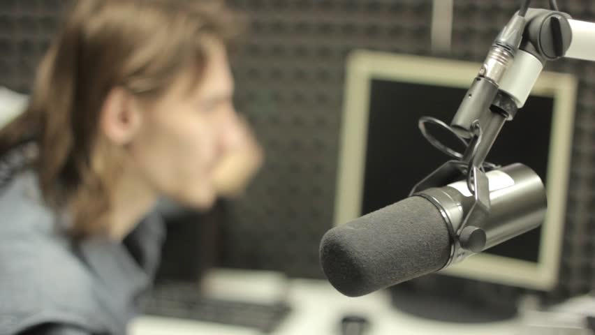 A man speaking in a radio studio