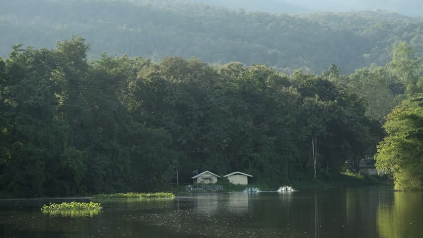 Beautiful twin hut with hill and lake - timelapse