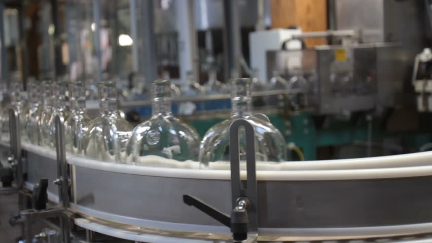 Bottles on assembly line inside bottling facility of Kentucky bourbon distillery.