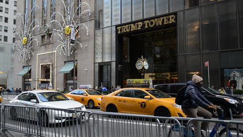 NEW YORK CIRCA NOVEMBER 2016. Once a quiet building, post election Trump Tower on 5th Avenue has been teeming with NYPD police and also tourists seeking to see the home of President elect Donald Trump