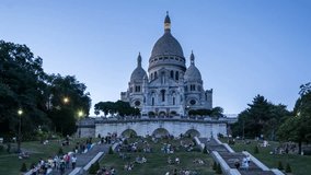 Sacre Coeur Basilica in Paris, France. Day to night transition. Time lapse video. Illumination switch on.