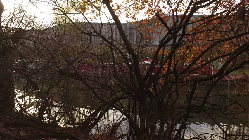 Canal barge through the trees.