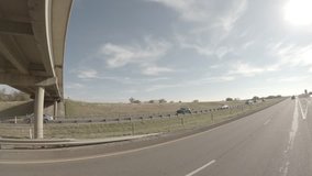 Taking an off-ramp in Rural Texas. Provides a beautiful half-panorama of the surrounding countryside. 

Raw video file from the camera. Protune optimized for maximum post-processing abilities. 