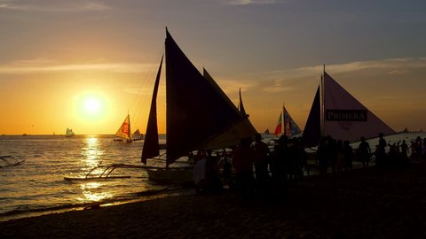 Sunset & Silhouettes Of Sailing Boats; Boracay Philippines