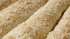 Rolled and baked thin sheets of dough with filling close-up slow tilt 4K 2160p 30fps UHD footage - Filo pie with sesame cheese and spinach after baking 3840X2160 UltraHD  tilting video