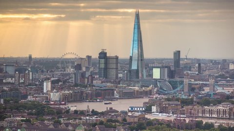 LONDON - AUGUST 2016 : Timelapse of the city of london skyscapers and Shard shot zoomed in from a high vantage point far away. amazing sunrays are captured during this shot, London. AUGUST 09, 2016