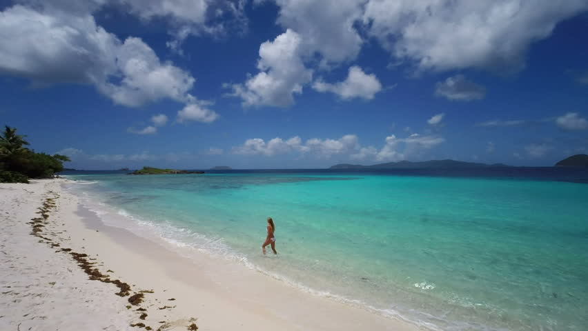 Aerial view of a bikini woman walking on the beach, st john, United States Virgin Islands
