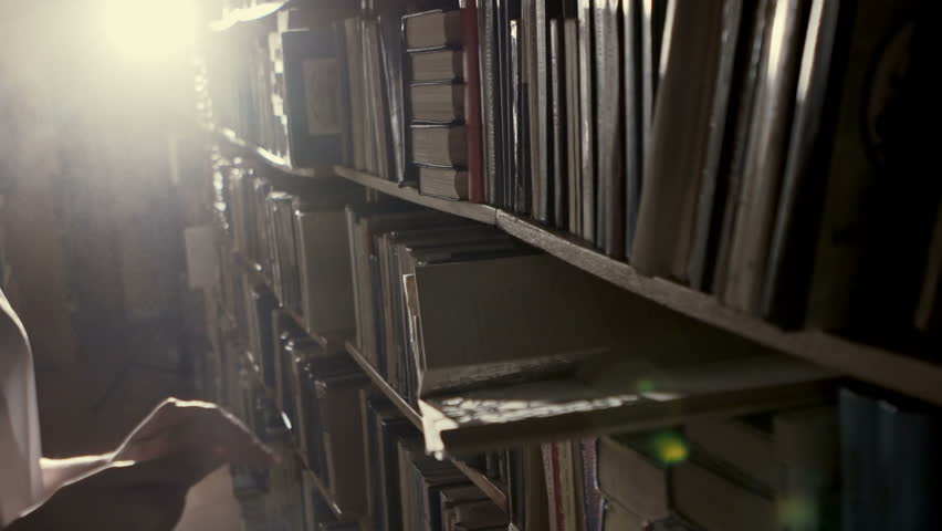 The girl in the library blown dust from the old quarter of the document