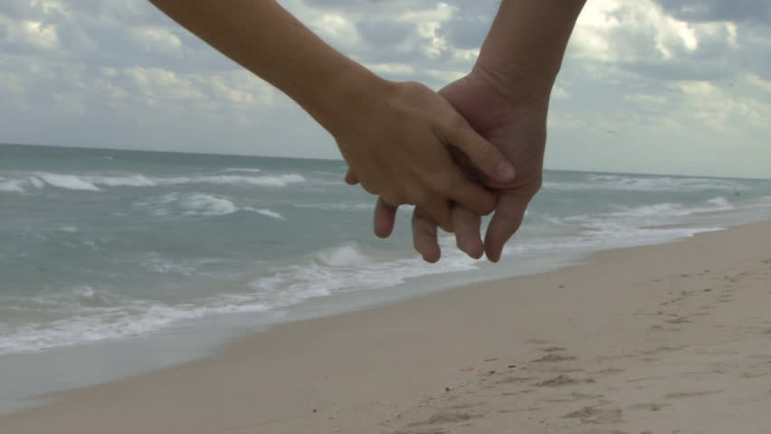 Couple Holding Hands Walking Along Stock Footage Video 100 Royalty