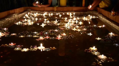 Thai people float on water a small rafts (Krathong) to celebrate the Loykrathong Festival Day Stock Video
