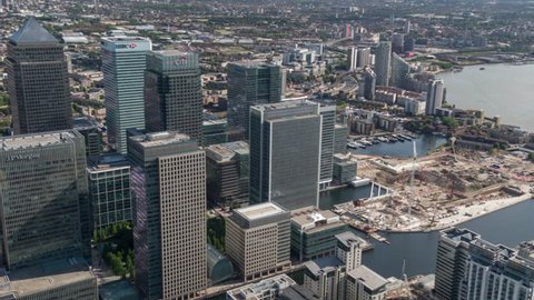 4k aerial view of the london docklands skyline from a helicopter