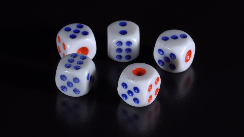 White dice rotate on a black table