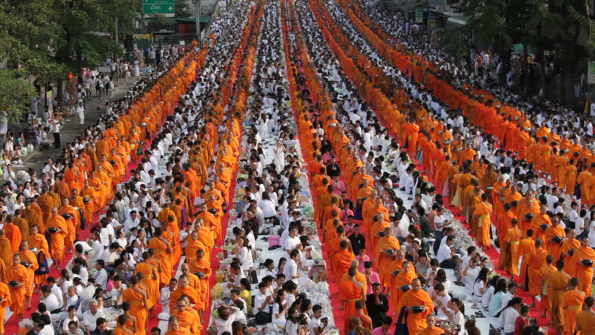BANGKOK, MARCH 18, 2012: Monks are participating in a Mass Alms Giving of 12,600