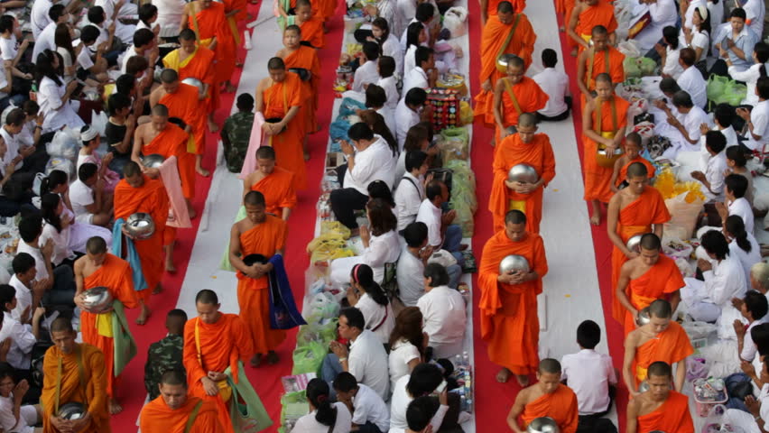 BANGKOK, MARCH 18, 2012: Monks are participating in a Mass Alms Giving of 12,600