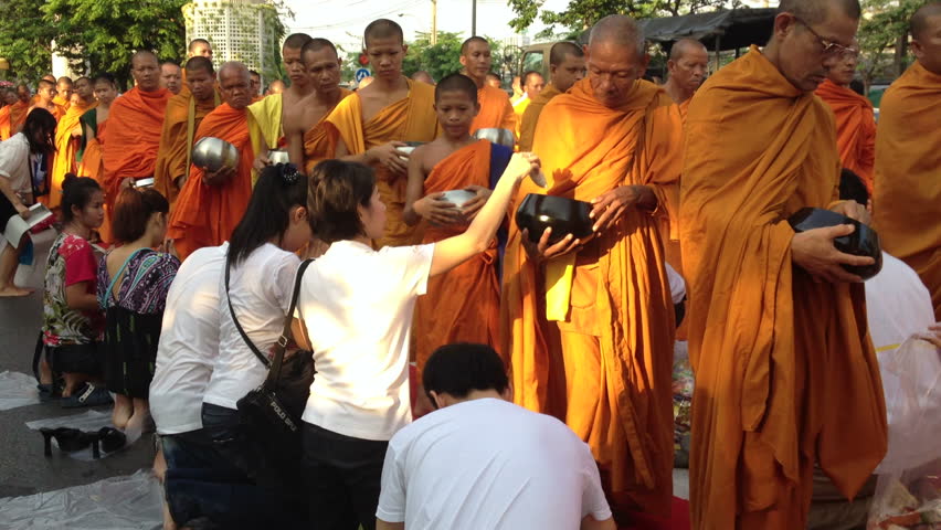 BANGKOK, MARCH 17, 2012: Monks are participating in a Mass Alms Giving of 12,600