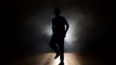 Dancer in the smoke in the dark.