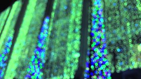 Bright and colorful holiday lights background in sparkling abstract defocus